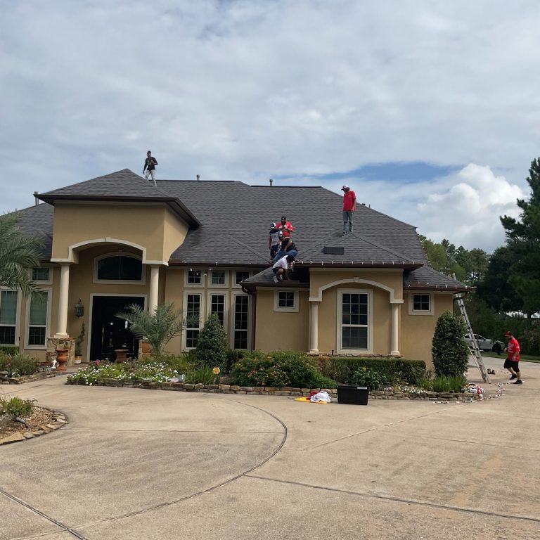 professional christmas light installation crew working on residential home in Tomball TX